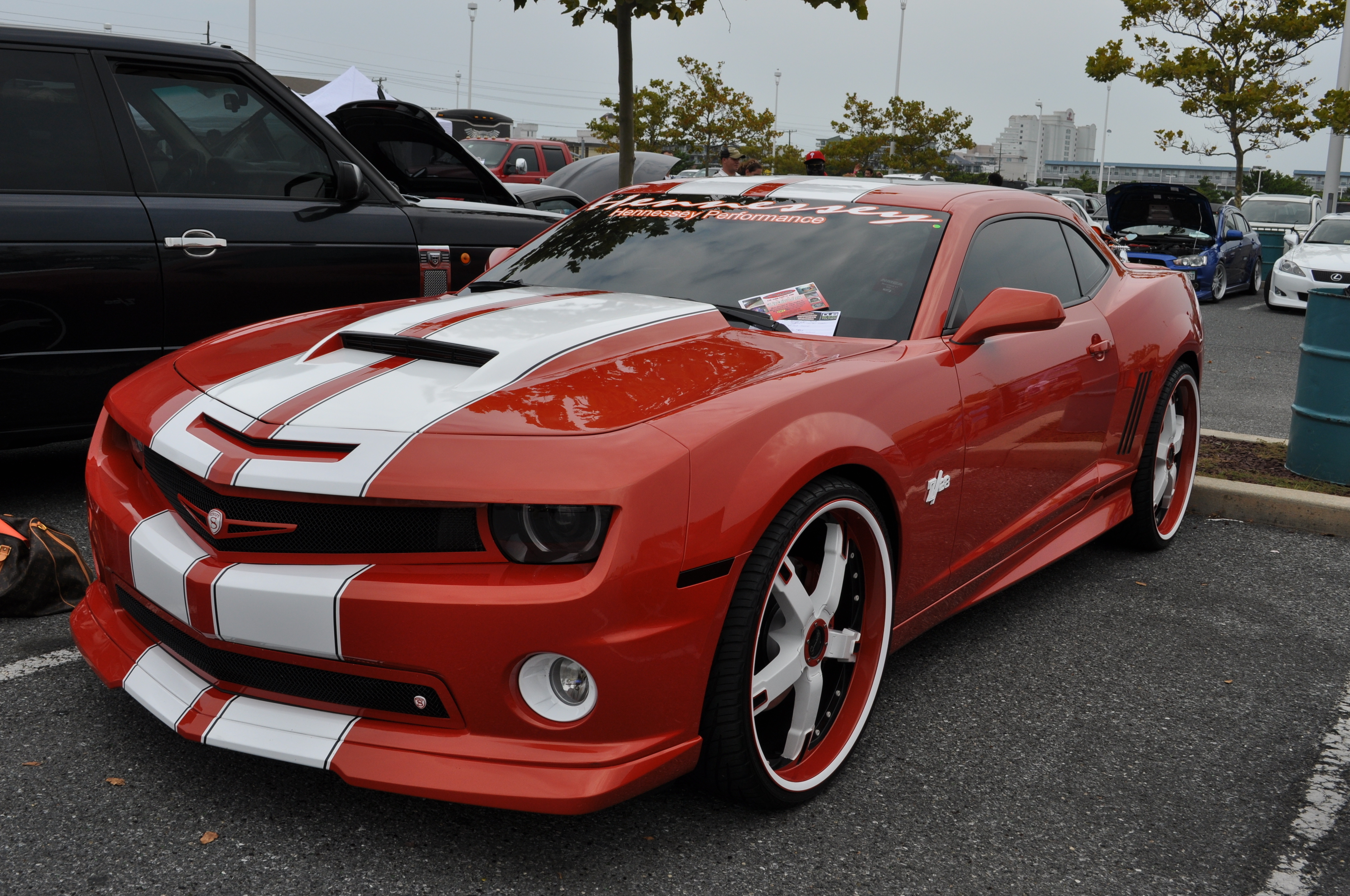 Фото тюнинг шевроле. Тюнинговая Шевроле Камаро. Chevrolet Camaro красная. Chevrolet Camaro тюнингованный. Шевроле Камаро тюнинг красный.