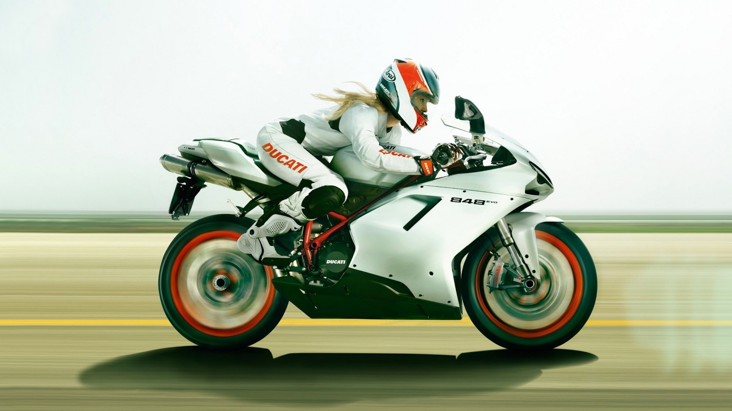 К чему снится мотоцикл. Ducati мотошкола. Катя Дукати. Ducati 848 EVO Racer. Девушка едет на мотоцикле.