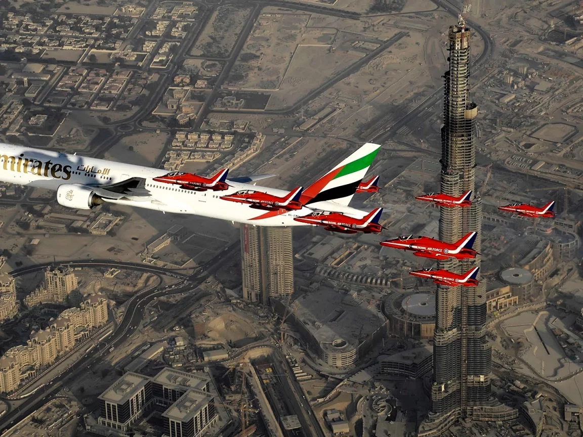 Aircraft above skyscrapers in Dubai