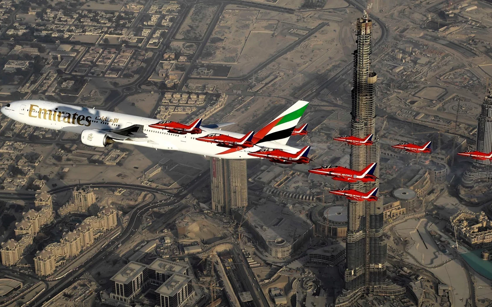 Aircraft above skyscrapers in Dubai