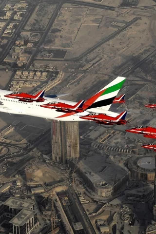 Aircraft above skyscrapers in Dubai